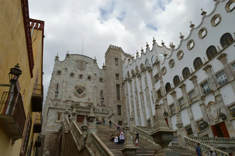 people walking on street near white concrete building during daytime — Guanajuato