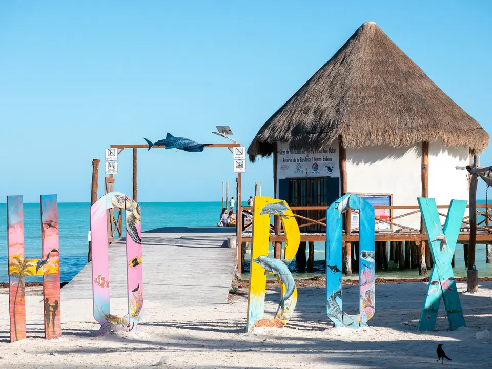 Colorful letters spell out holbox by a beach hut — Holbox