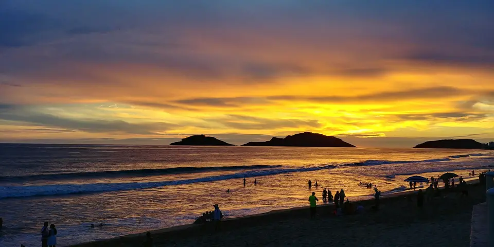 people at the beach during golden hour — Mazatlán
