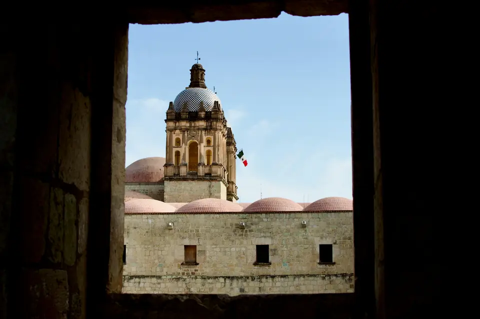 A church is framed by the window — Oaxaca