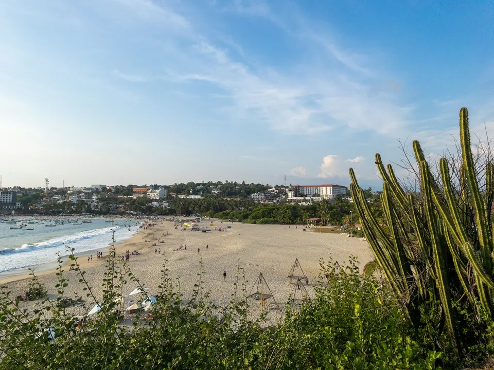 a beach with a lot of people on it — Puerto Escondido