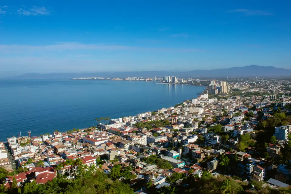 a large body of water surrounded by a city — Puerto Vallarta